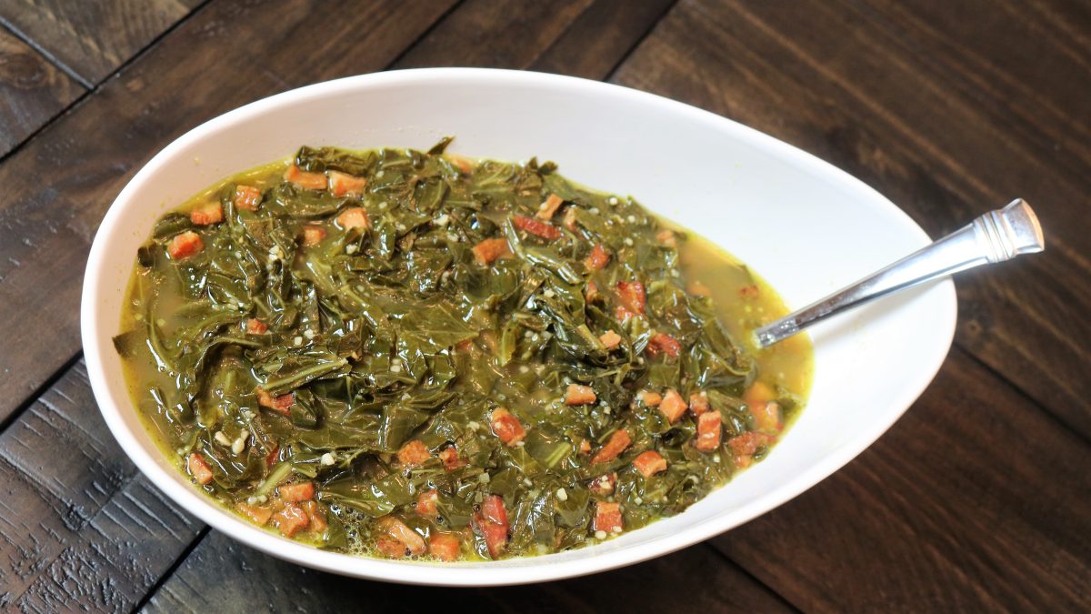 A bowl of food on top of a wooden table.