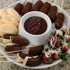 A white plate topped with different types of food.