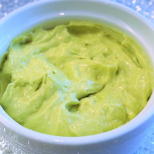 A bowl of guacamole is shown in this picture.