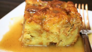A close up of bread pudding on a plate