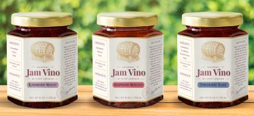 A jar of jam with the label " jam vino ".