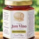 A jar of jam with the label for it.