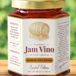 A jar of jam with the label " cranberry apple blossom ".