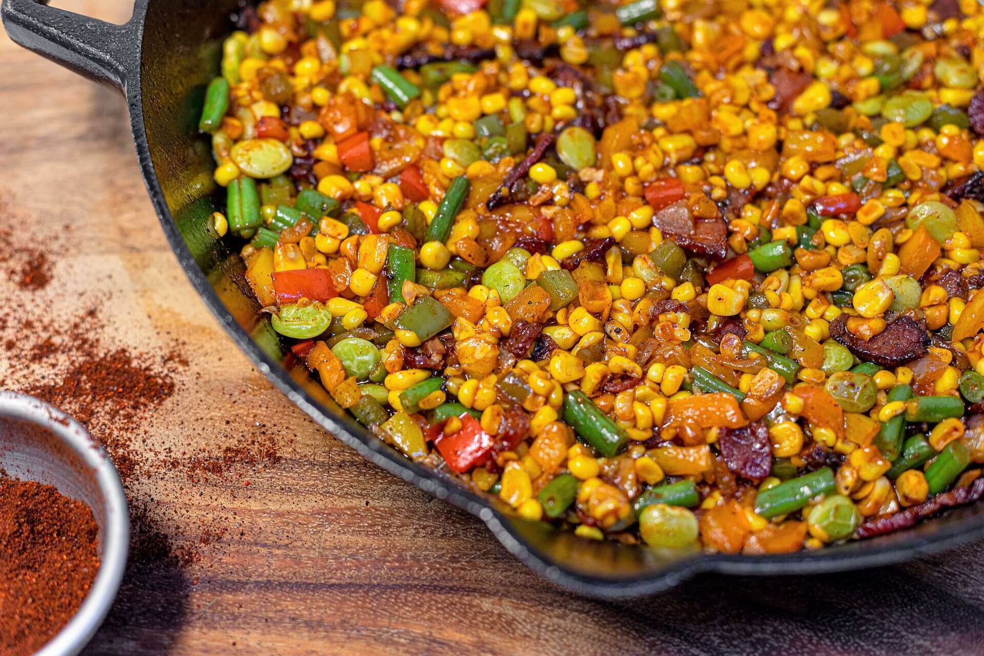 A Corn and Vegetables in a Black Color Iron Skillet