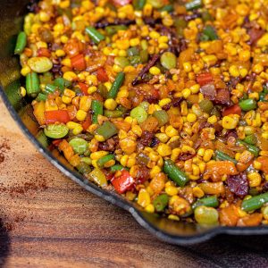 A pan of corn and beans on top of a table.