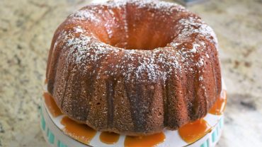 A bundt cake with powdered sugar on top of it.