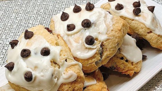 A close up of some cookies with white frosting