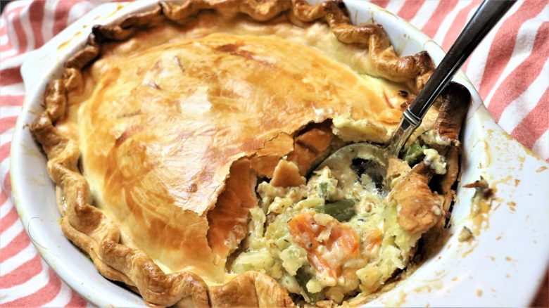 A close up of a pie with some vegetables