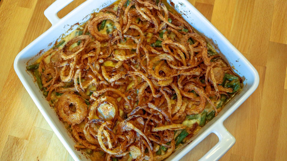 A casserole dish with some fried onions on top of it