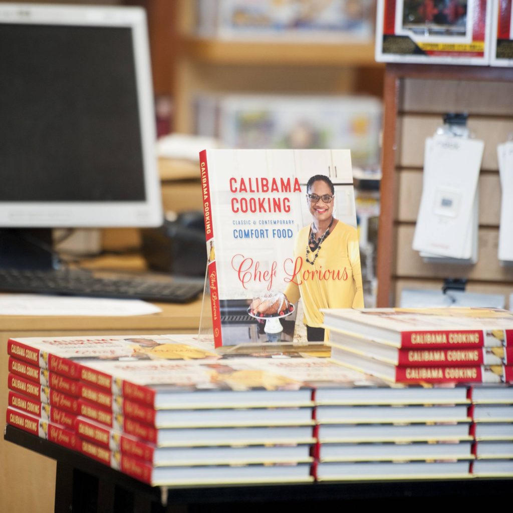 A stack of cookbooks on top of each other.